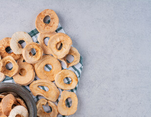 Dry apple slices out of a metallic pot