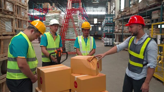 4K, Caucasian chief with hard helmet unacceptable crash broke cardboard box from workers, logistic problem in warehouse factory, senior worker scold staff about unaware carrying packing damaged boxes
