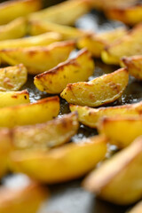 homemade potato wedges on a baking sheet