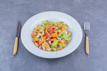 Vegetable salad with seasonal foods in a ceramic dish