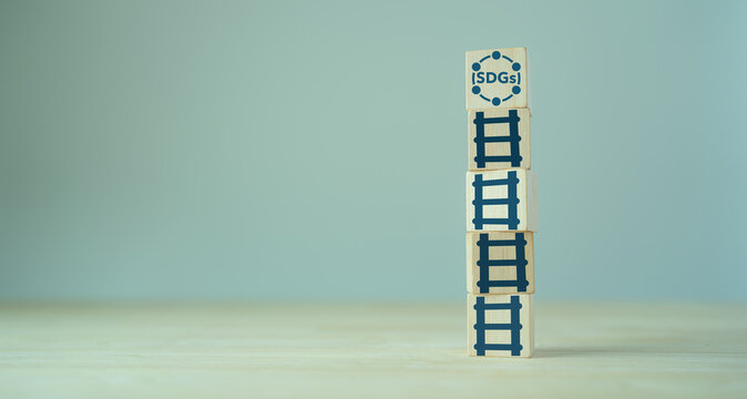 Sustainable development goals. SDGs. concept. The 2030 Agenda for sustainable development. Developed in cooperation with UN system. Wooden cubes with SDGs strategy and alignment policy icons.