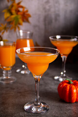 Pumpkin fall seasonal drink cocktail latte with spices and whipped cream for Thanksgiving or...