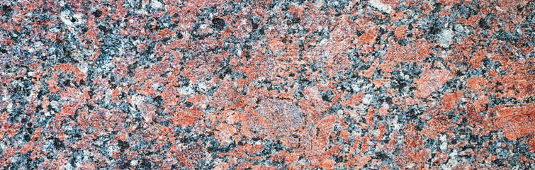 Abstract red granite background. Banner of red granite surface. Stone background of granite