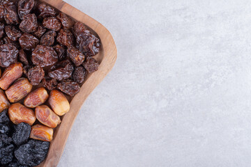 Set of dried fruits on a wooden platter