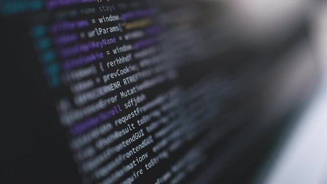 Macro view of laptop screen with code writing, programmer coding software in office