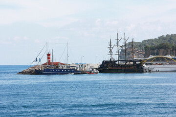 seascape with cargo ships and pleasure yachts in the gulf of the Mediterranean sea