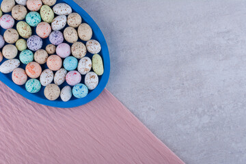 Colorful stone candies on a piece of tablecloth
