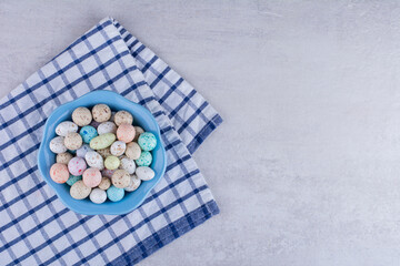 Colorful stone candies on a piece of tablecloth