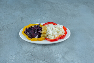 Chopped vegetable salad in a white plate