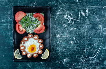 Breakfast platter with fried egg, garnish and salad