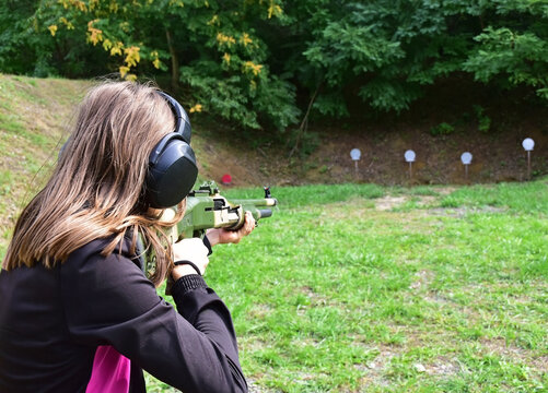 Woman with a gun at the sport shooting competition