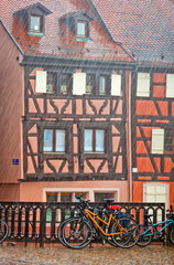 Fototapeta na wymiar Picturesque city view during the summer rain. Colmar city, Alsace region, France