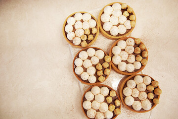 French aesthetic hazelnut creamy tarts in the row. Vintage background. Copy space