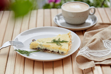 Healthy vegetarian homemade pie with mushrooms with cheese. Cup of coffee, lunch or breakfast. Italian food