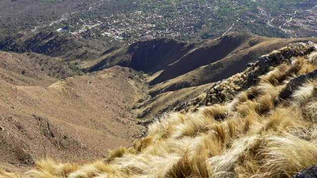 View from the mountainside in Merlo, San Luis. Argentina. grasses moving in the wind. Slow motion video.