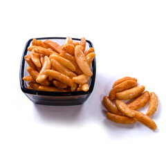 puffed rice in black glass bowl close up on white background