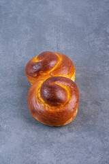 Obraz premium Swirly sweet bun on marble background