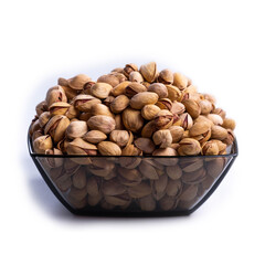 Salted pistachios in glass bowl isolated on white background