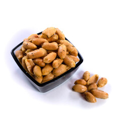 pile of spiced peanuts isolated close up on white background 