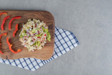 Cabbage and lettuce salad on a wooden board