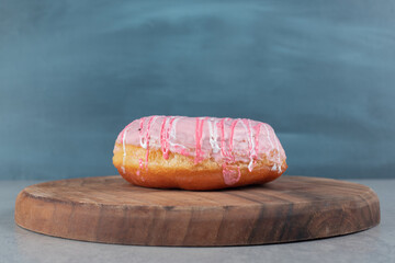 Doughnuts with cream on the top isolated on concrete background