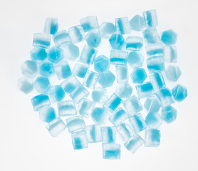 Blue ice cubes isolated white background. freshness. freezing. frozen pieces of ice close up