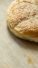 The homemade bread rolls with sesame seeds. Burger buns with sesame seeds, ingredients for hamburger.
