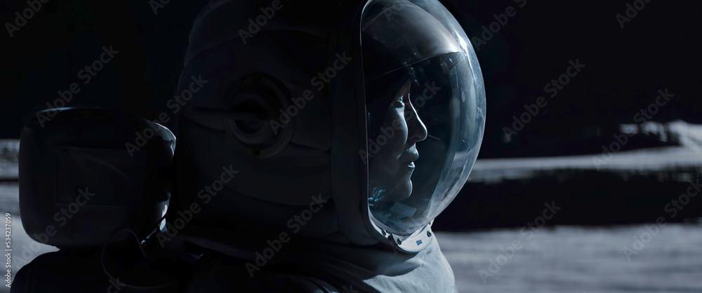 Wall mural portrait of asian lunar astronaut opens his visor while exploring moon surface