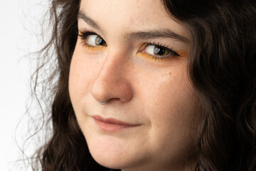 Young woman looking at camera in state of disbelief