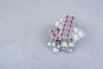 Stack of medical drugs on marble background