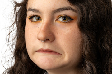 Fototapeta premium Young woman making a grimacing face to the camera