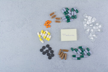 Assortment of medical drugs on marble background