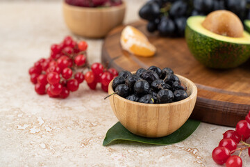 A wooden bowls full of delicious berries