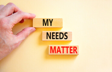 My needs matter symbol. Concept words My needs matter on wooden blocks. Businessman hand. Beautiful white table white background. Business, psychological and my needs matter concept. Copy space.