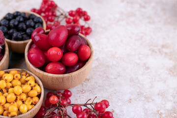 A wooden bowls full of delicious berries
