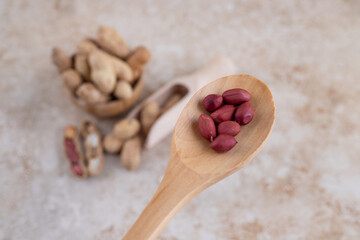 A wooden spoon of peeled delicious healthy nut