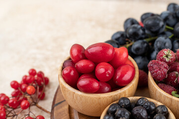 A wooden bowls full of delicious berries