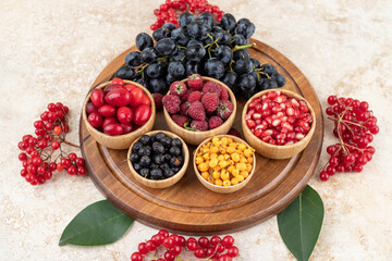 A wooden bowls full of delicious berries