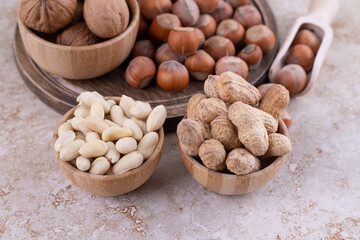 A wooden board full of healthy various nuts