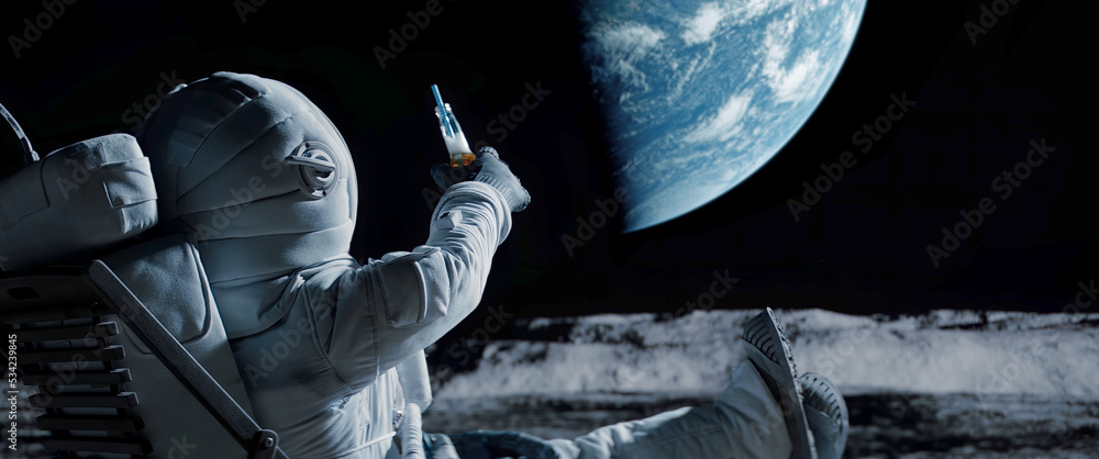 Wall mural back view of lunar astronaut having a beer while resting in a beach chair on moon surface, saluting 