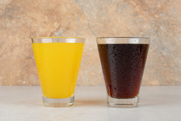 Two glasses of lemonades on stone table