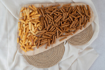 Obraz premium Two types of crackers on wooden board