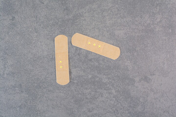 First band aid stickers on marble background