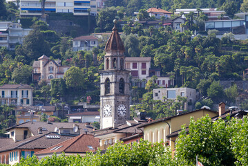Fototapeta na wymiar Church tower at village of Ascona, Canton Ticino, on a sunny summer day. Photo taken July 24th, 2022, Ascona, Switzerland.