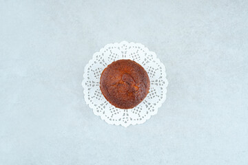 One whole delicious sweet cupcake on white background