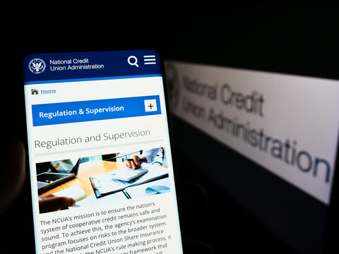 Stuttgart, Germany - 09-25-2022: Person Holding Mobile Phone With Webpage Of US National Credit Union Administration (NCUA) On Screen With Logo. Focus On Center Of Phone Display.