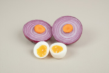 Boiled egg with sliced onion and carrot