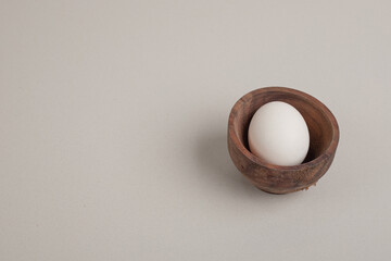 Fresh chicken white egg in wooden bowl