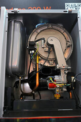 Modern gas condensing boiler disassembled. Section gas condenser