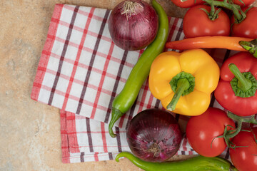Fresh colorful vegetables on tablecloth background